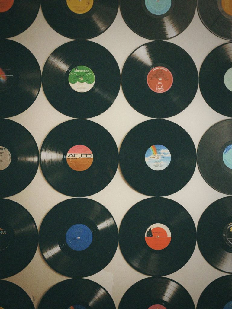 Wall of vintage vinyl records with colourful labels